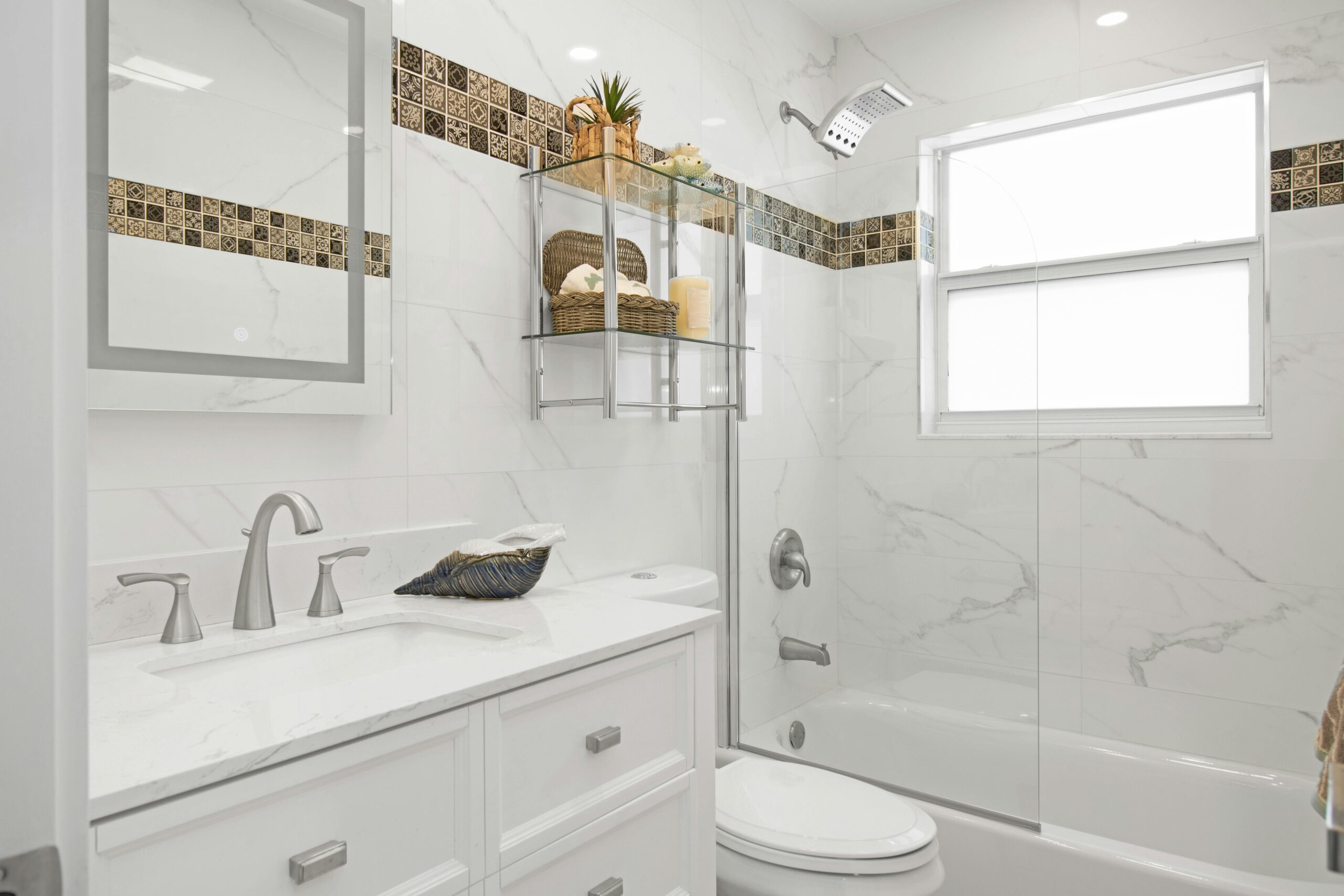 Contemporary bathroom with clean design, marble tiles, and sleek fixtures.